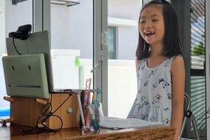 Female child utilizing online learning tips to be successful in online courses.