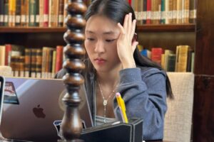 student sitting in library learning